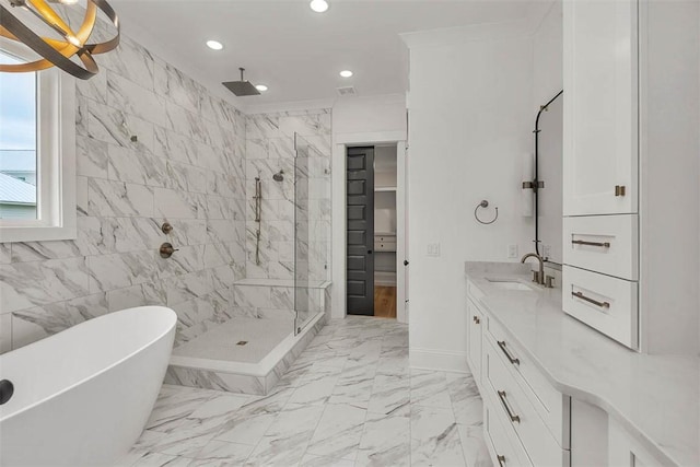 128 W Point Pkwy, Saint Simons Island, GA 31522 - bathroom featuring a stall shower, recessed lighting, vanity, marble look tile flooring, and a freestanding tub