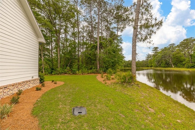 128 W Point Pkwy, Saint Simons Island, GA 31522 - view of green lawn with a water view