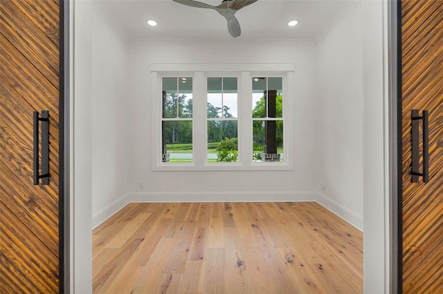 128 W Point Pkwy, Saint Simons Island, GA 31522 - spare room with baseboards, light wood-style flooring, ornamental molding, ceiling fan, and recessed lighting