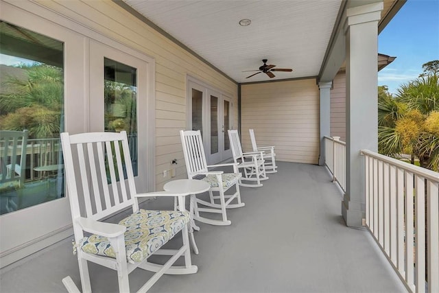 balcony featuring ceiling fan and french doors