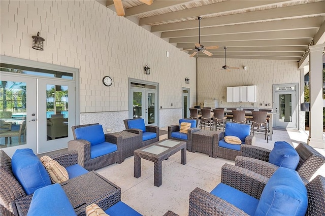 view of patio featuring outdoor lounge area, ceiling fan, and french doors