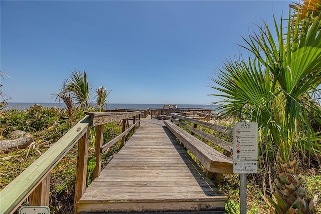 surrounding community featuring a water view