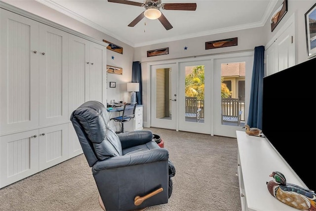 sitting room with ceiling fan, light colored carpet, ornamental molding, and french doors