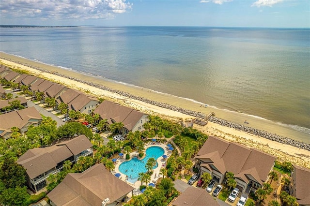 aerial view with a water view and a beach view