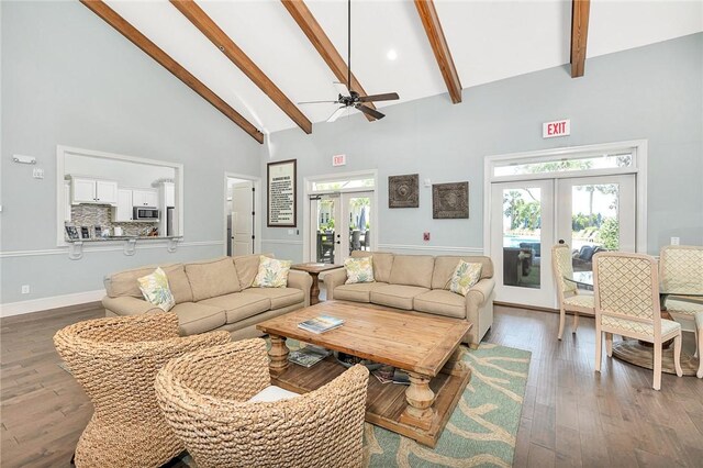 living room with ceiling fan, french doors, high vaulted ceiling, and hardwood / wood-style flooring