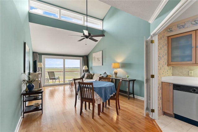 345 Moss Oak Cir, Saint Simons Island, GA 31522 - dining space with ceiling fan, light wood-style floors, and high vaulted ceiling