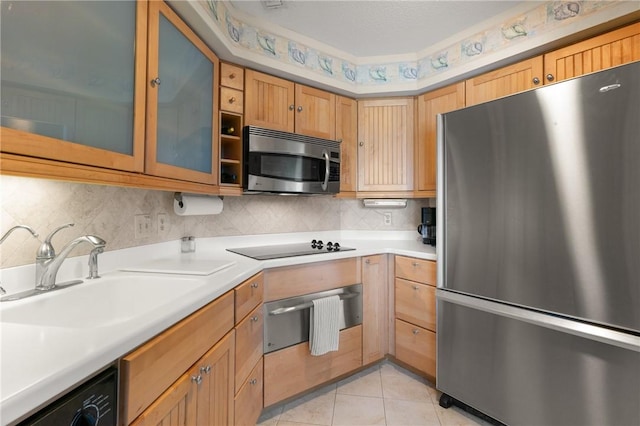 345 Moss Oak Cir, Saint Simons Island, GA 31522 - kitchen with stainless steel appliances, a warming drawer, light countertops, and decorative backsplash