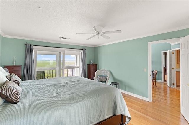 345 Moss Oak Cir, Saint Simons Island, GA 31522 - bedroom with light wood finished floors, crown molding, access to outside, and ceiling fan