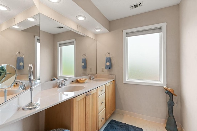 345 Moss Oak Cir, Saint Simons Island, GA 31522 - full bath with double vanity and tile patterned floors
