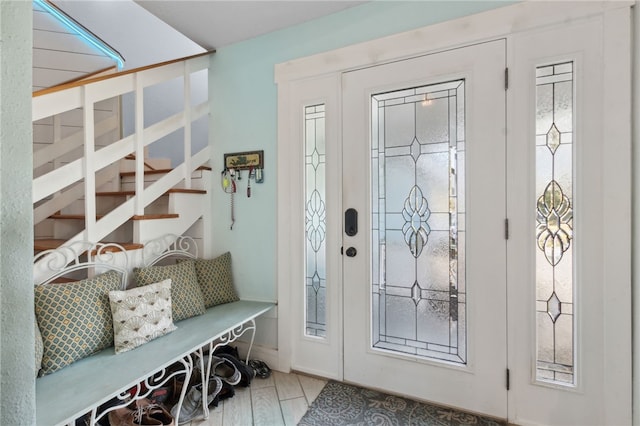 foyer featuring stairs