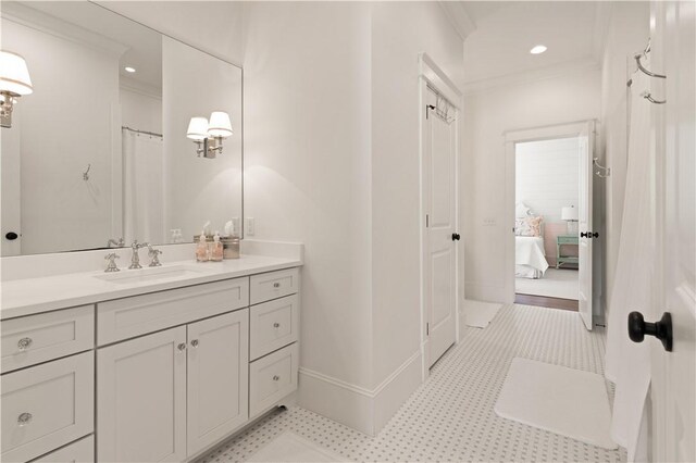 bathroom with vanity and crown molding