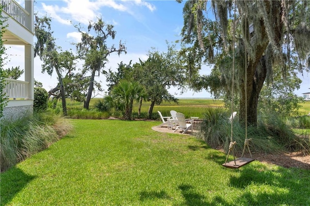 view of yard with a fire pit