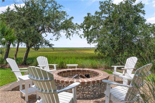 view of patio / terrace with a rural view and a fire pit