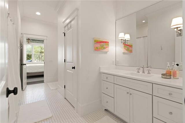 bathroom featuring vanity and ornamental molding