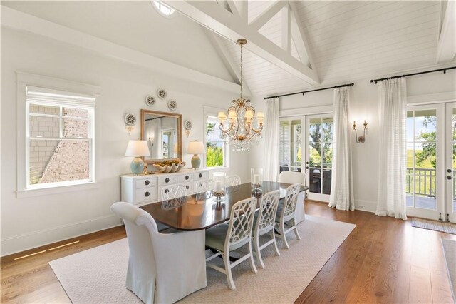 dining area featuring high vaulted ceiling, an inviting chandelier, french doors, light wood-type flooring, and beamed ceiling