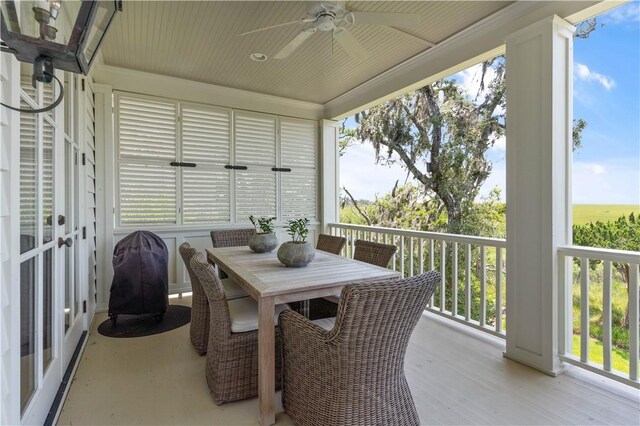 sunroom featuring ceiling fan and a wealth of natural light