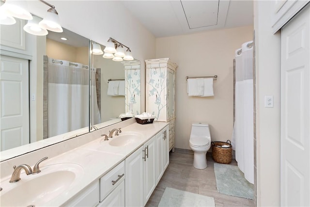 bathroom with vanity, a shower with curtain, and toilet