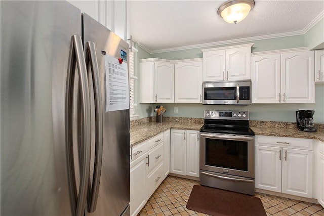 kitchen featuring light tile patterned floors, white cabinetry, stainless steel appliances, ornamental molding, and light stone countertops