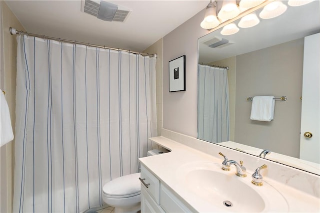 bathroom featuring vanity, curtained shower, and toilet