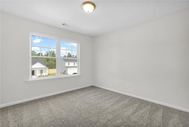 11026 Woodland Trl, Brunswick, GA 31525 - empty room featuring carpet floors and baseboards