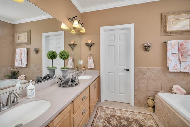 bathroom with tile patterned flooring, vanity, ornamental molding, and tiled tub