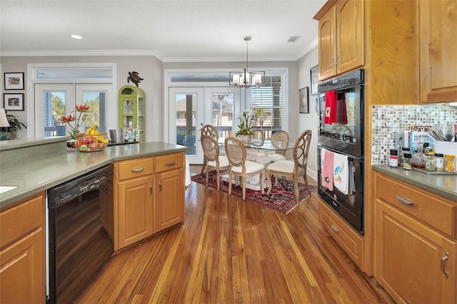 kitchen featuring tasteful backsplash, french doors, black appliances, and ornamental molding