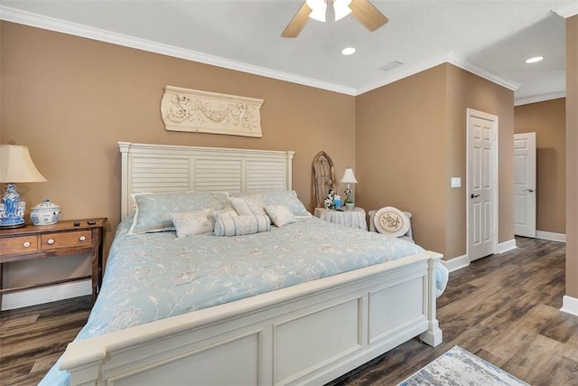 bedroom with baseboard heating, ceiling fan, crown molding, and dark wood-type flooring