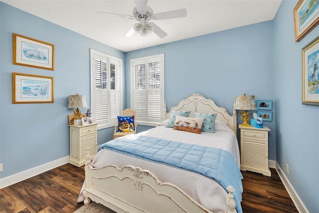 bedroom with ceiling fan and dark wood-type flooring