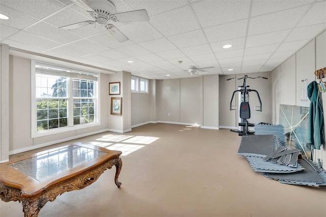 workout room featuring a paneled ceiling and ceiling fan