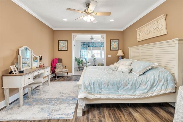 bedroom with hardwood / wood-style floors, ceiling fan, and crown molding