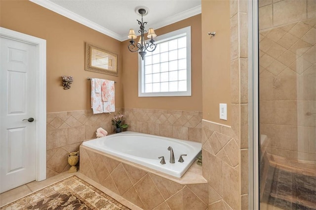 bathroom with a notable chandelier, crown molding, plus walk in shower, and tile walls