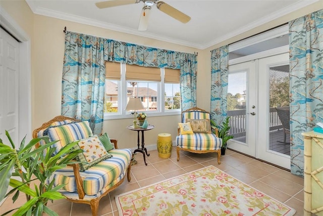 sitting room featuring french doors, light tile patterned floors, and crown molding