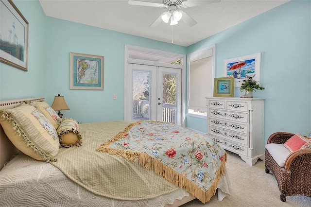 bedroom featuring access to exterior, french doors, carpet floors, and ceiling fan