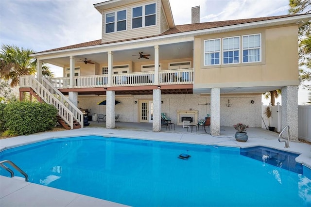 rear view of house featuring a patio area and french doors