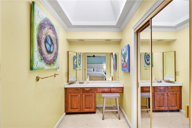 bathroom featuring vanity, ceiling fan, and crown molding