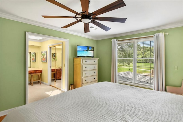 carpeted bedroom featuring connected bathroom, ceiling fan, and crown molding