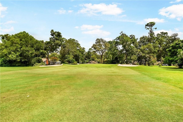 view of home's community featuring a lawn