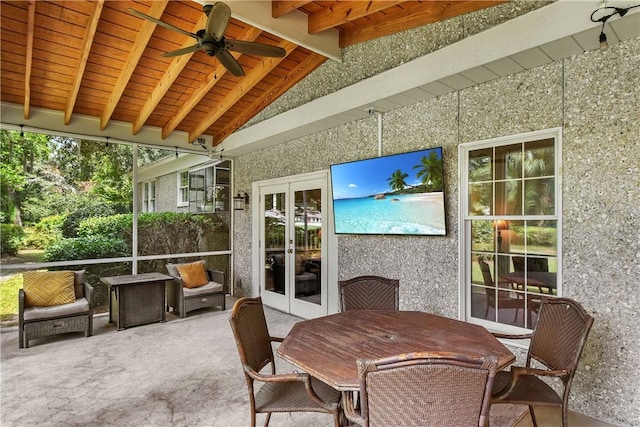 sunroom featuring wood ceiling, ceiling fan, french doors, and lofted ceiling with beams