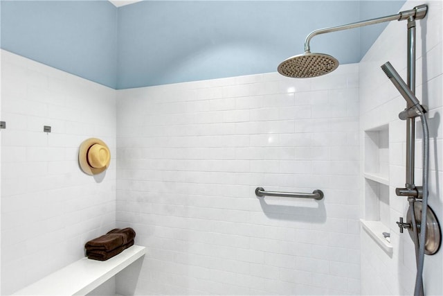 bathroom with a tile shower