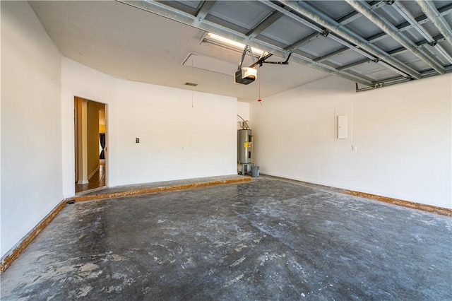 garage with a garage door opener and electric water heater