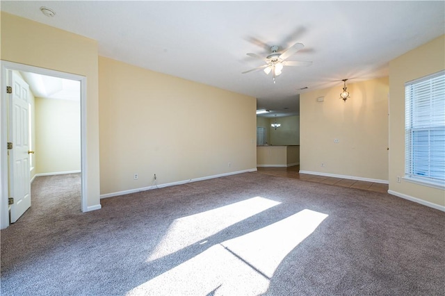 spare room with carpet flooring and ceiling fan