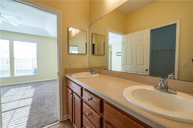 bathroom featuring ceiling fan, vanity, and tile patterned floors