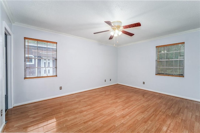 1501 Charles St, Waycross, GA 31501 - spare room featuring light wood-style floors, ceiling fan, and crown molding