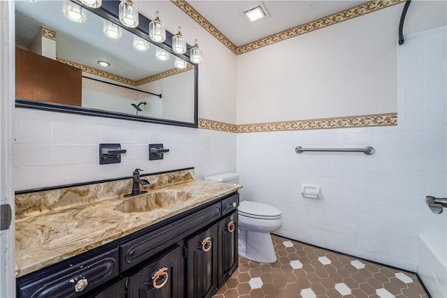 1501 Charles St, Waycross, GA 31501 - bathroom featuring tile walls, vanity, wainscoting, tile patterned floors, and shower / bath combination