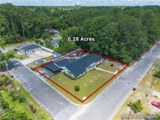 1501 Charles St, Waycross, GA 31501 - aerial view of property's location with property boundaries highlighted and a heavily wooded area