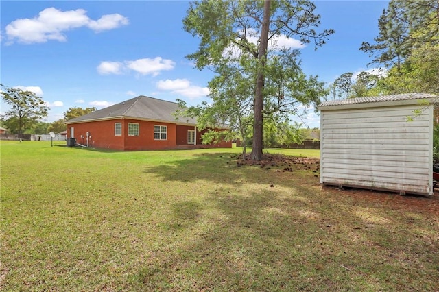 129 Taylor Wells Ln, Hinesville, GA 31313 - view of yard with an outbuilding and a storage shed