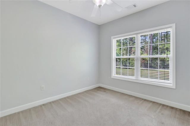 129 Taylor Wells Ln, Hinesville, GA 31313 - spare room featuring a ceiling fan, light carpet, baseboards, and visible vents