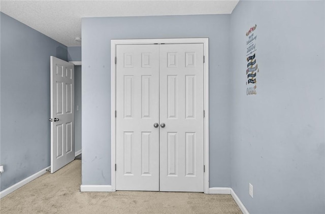 326 Daniel Trent Way, Kingsland, GA 31548 - unfurnished bedroom with carpet floors, baseboards, and a closet