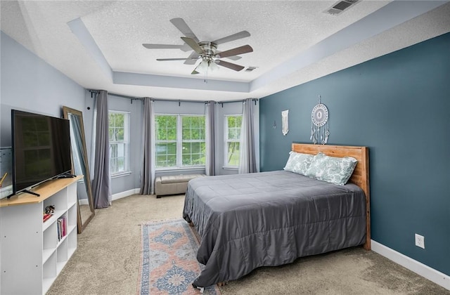 326 Daniel Trent Way, Kingsland, GA 31548 - carpeted bedroom with a textured ceiling, a raised ceiling, baseboards, and ceiling fan