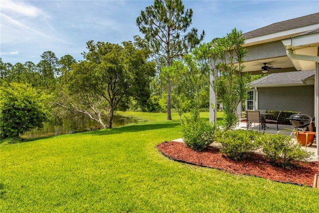 326 Daniel Trent Way, Kingsland, GA 31548 - view of grassy yard with ceiling fan and a patio area